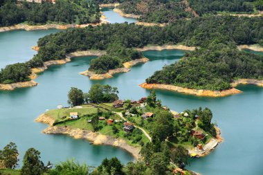 A beautiful panoramic view of El Penol Reservoir Lake from the giant Guatape Rock in Medellin Colombia. clipart