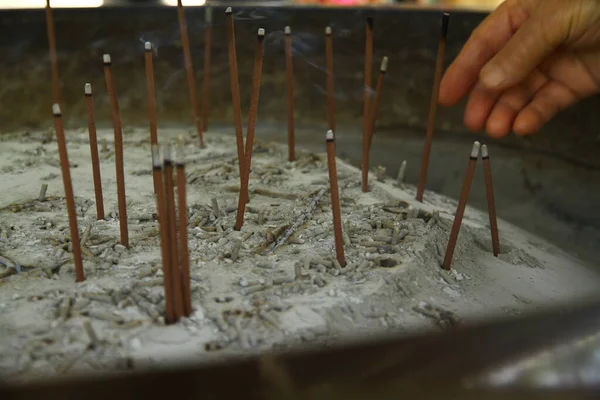 Burning incense sticks in Nanzen-ji Buddhist Temple, Japan