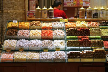 View on stalls with spices, dried fruits, nuts and sweets in the Turkish marketplace
