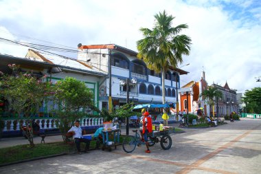 IQUITOS, PERU - 25 April 2019. A street view from the riverbank of Amazon River. Iquitos is the country's largest city not reachable by road. It is connected to Lima by air.