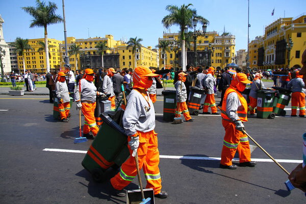 PLAZA DE ARMAS, LIMA, PERU - 21 April 2019. Sanitation workers are cleaning the square after the festivities of Semana Santa at Plaza de Armas