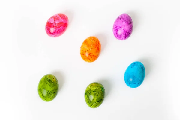 Colorful painted easter eggs laying on white background — Stock Photo, Image