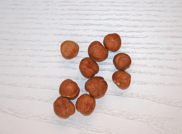 Hazelnuts Peeled Light Wooden Surface Hazelnuts Peeled Nuts Scattered Nuts — 스톡 사진