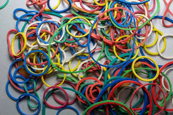 Colored rubber bands on a table — 스톡 사진