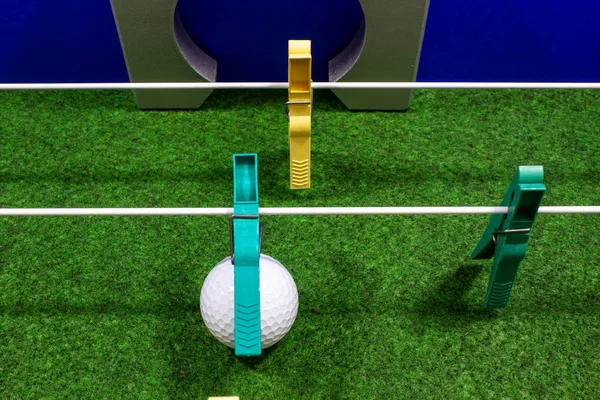 Clothespins lined up in the form of a football kicker — Stock Photo, Image