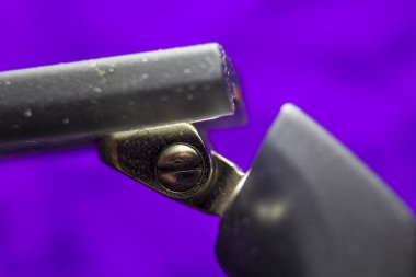 Macro picture of a screw in a spectacle frame