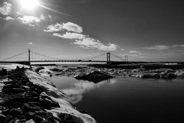 bridge over the river to the sea, with ice chunks and ice floes