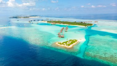 Aerial view maldives islands with water villas clipart