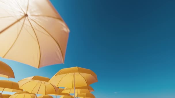 Beach umbrellas against blue sky — Stock Footage Beach Umbrellas Blue Sky Video Clip