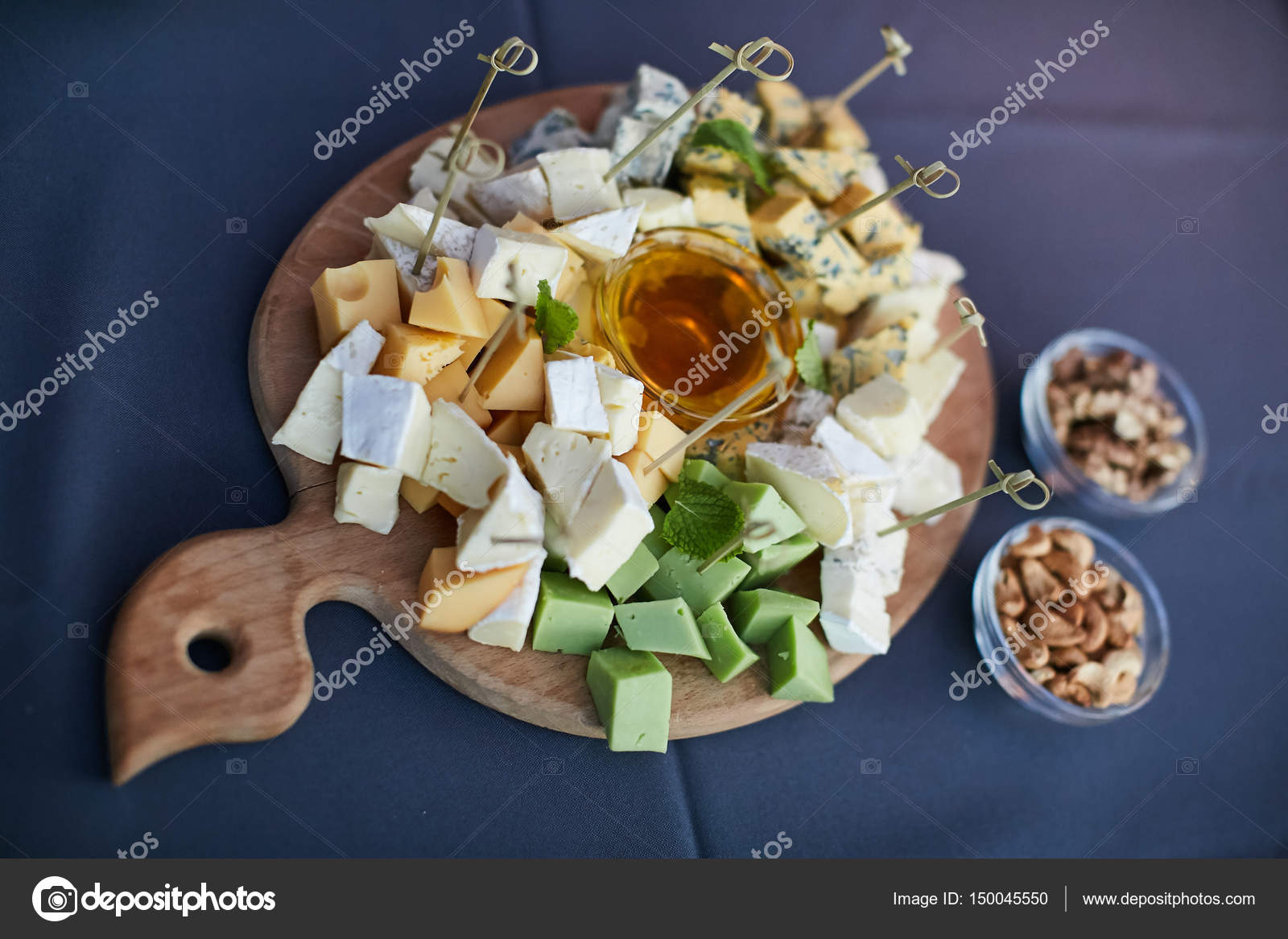 Cheese platter, Assorted with nuts and honey Stock Photo by ©serdiukov
