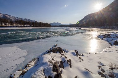 beautiful mountain river in the rays of the setting sun