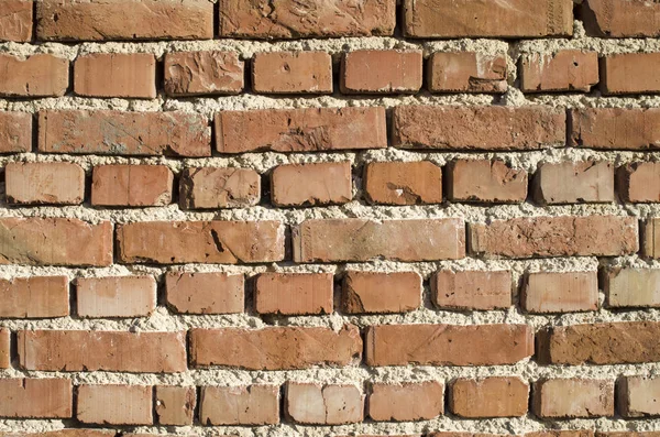 Ladrillos rojos en el viejo primer plano de la pared — Foto de Stock