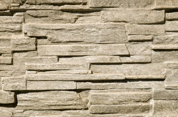 Decorative relief cladding slabs imitating stones