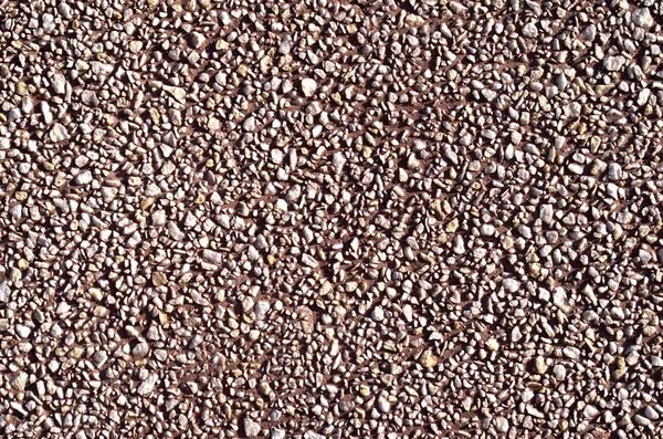 Pebble vermelho mosaico seixos parede closeup — Fotografia de Stock