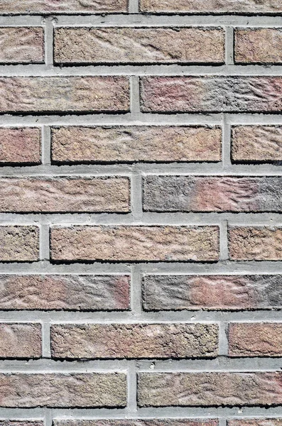 Blocs de béton coloré imitant les briques sur le mur — Photo