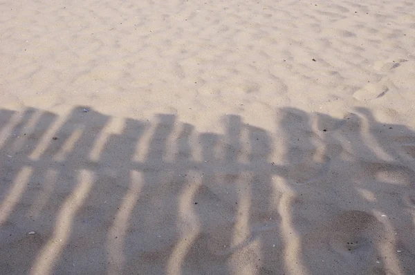Shadow of wooden shelter on the beach near — Stock Photo, Image