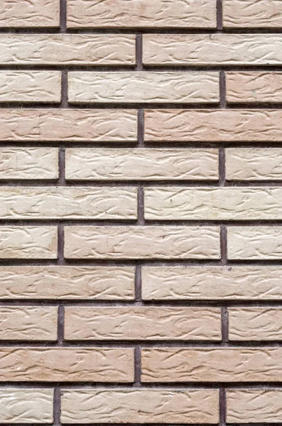 Plaques décoratives en relief imitant les briques sur le mur — Photo