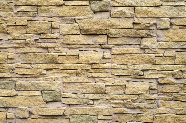 Losas de revestimiento en relieve decorativo imitando piedras en la pared — Foto de Stock