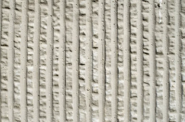 Gray decorative relief plaster on wall — Stock Photo, Image