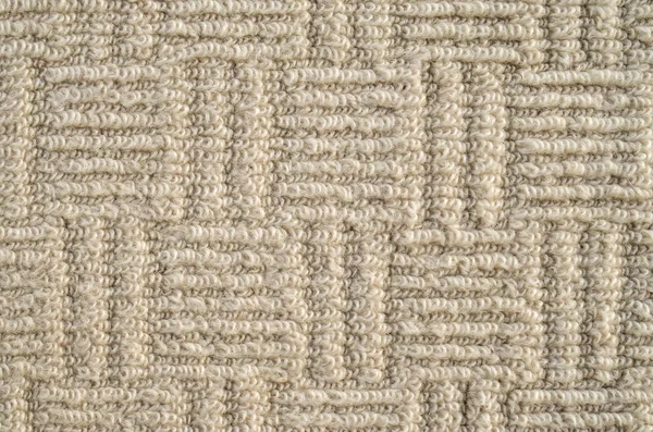 Closeup of beige ornamental carpet — Stock Photo, Image