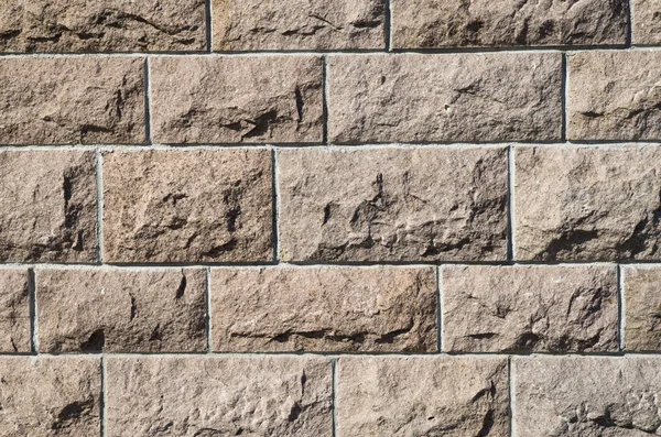 Vecchio muro di pietra primo piano al sole — Foto Stock