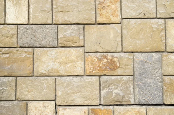 Antiga parede de pedra colorida closeup — Fotografia de Stock