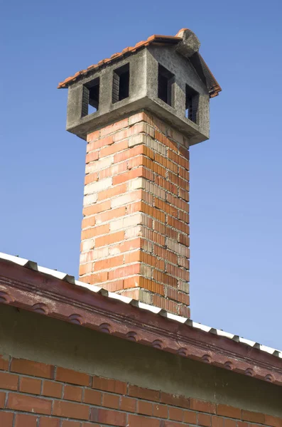 New brick chimney with rain protection closeup — Stock Photo, Image