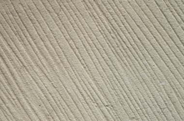 Paralel çizgileri olan işlenmiş kumtaşı