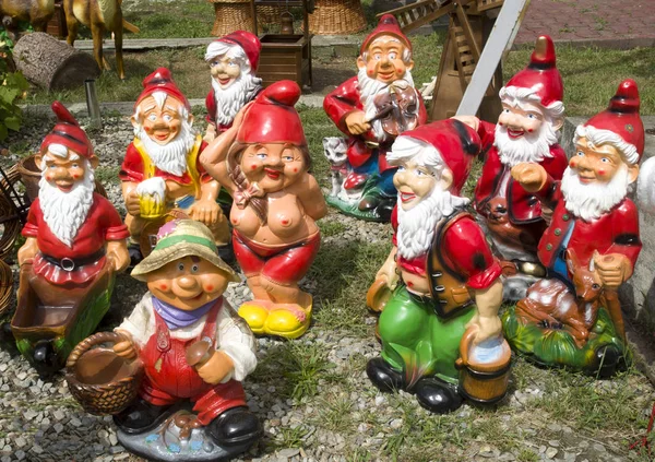 Many fanny garden gnomes  and one dancing female nude gnome, Rom — Stock Photo, Image