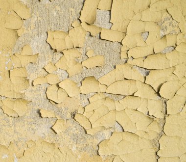 Sarı yağlı boyayla boyanmış eski duvar.