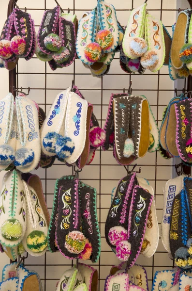 Colorful traditional greek woollen slippers in souvenir shop, Greece, Europ