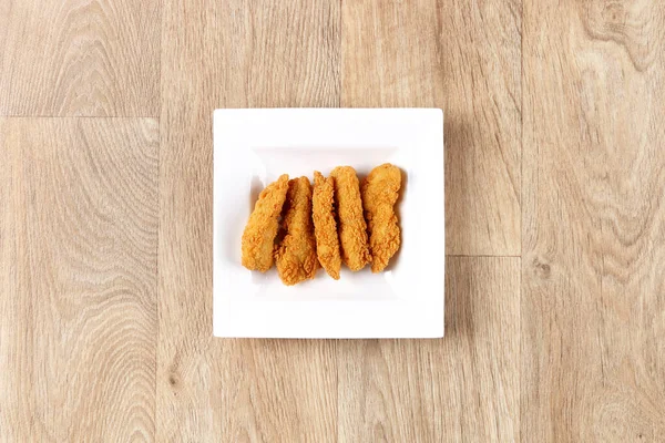 Crispy Chicken Strips Fingers White Plate Wooden Background Top View — Stock Photo, Image