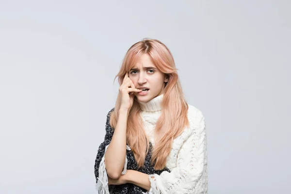 Studio Portrait Nervous Woman White Sweater Presses Hand Face Gnawing — Stockfoto