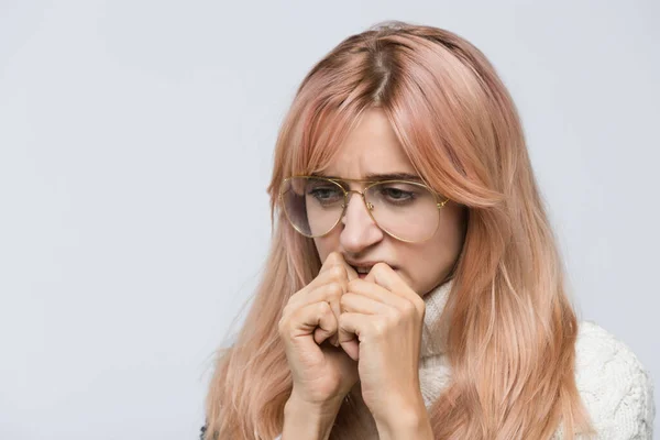 Cropped Studio Portrait Nervous Girl White Sweater Glasses Gnawing Nails — Stockfoto