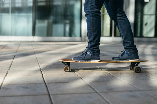 Male Dark Blue Jeans Sneakers Riding Longboard Paving Stones Asphalt — Stock Photo, Image