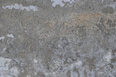Beton duvar. Dökülmüş duvarlarda yıpranmış eski boyalar.