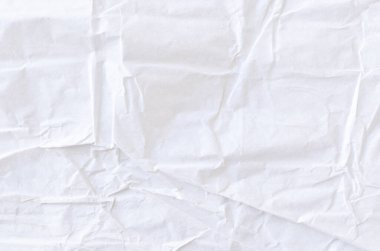 Kırışmış beyaz kağıdın dağınık kaplamasına sahip yaratıcı bir zemin.