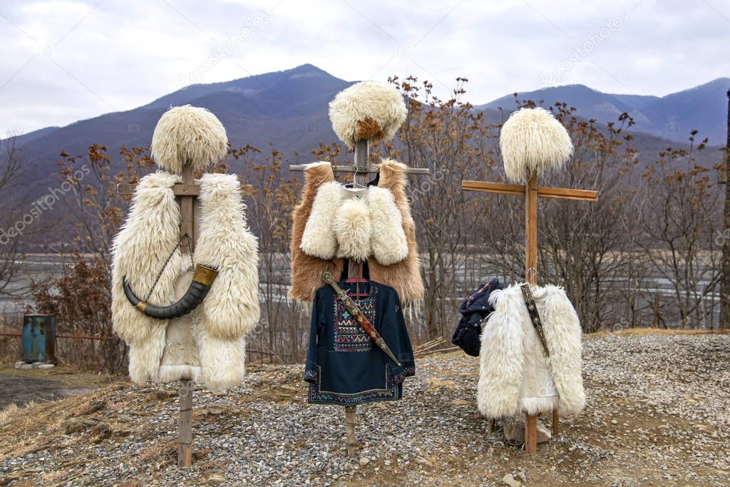 National clothes of Georgian shepherds burka and papakha against mountains