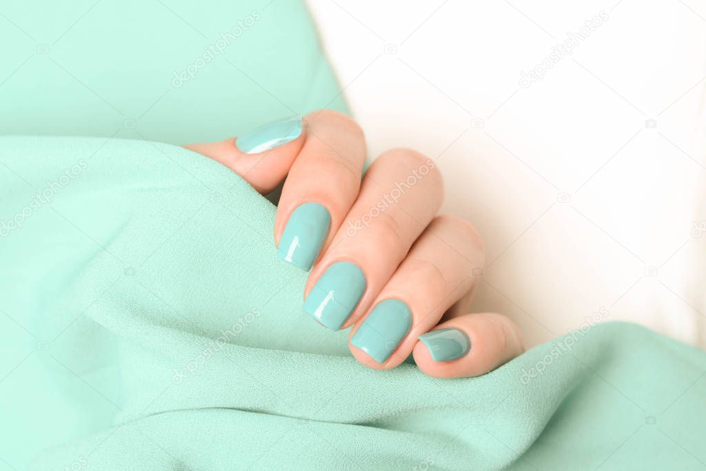 mint manicure on a mint and white background