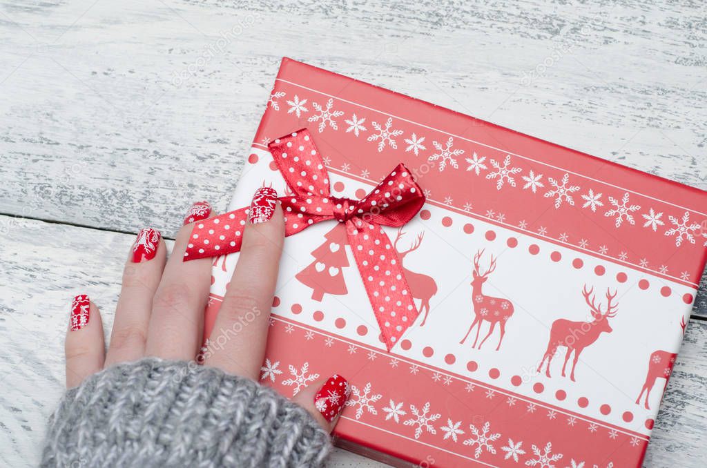 red Christmas manicure with deer and snowflakes