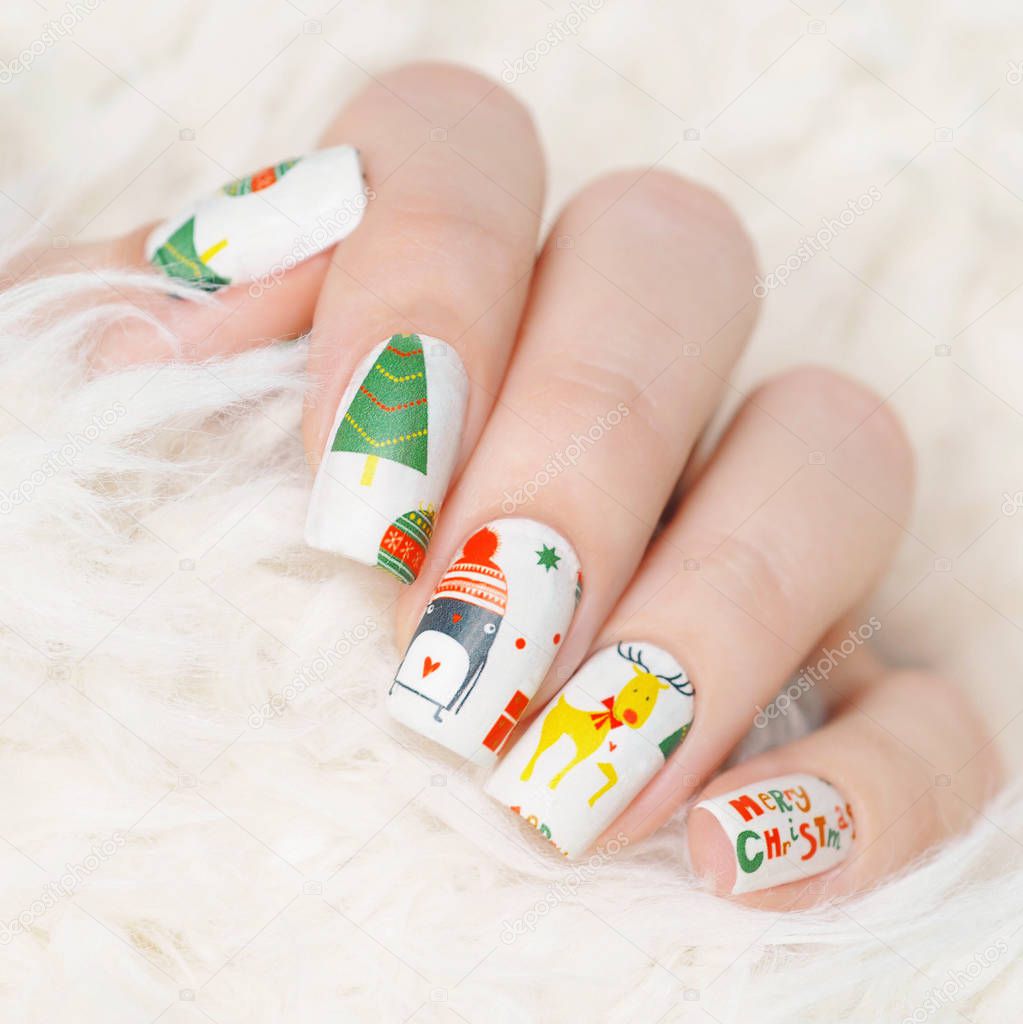 winter manicure with Christmas tree pattern, gift and deer
