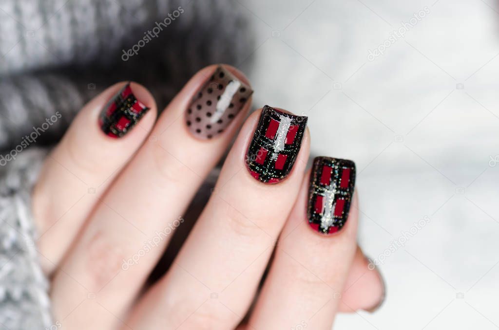 manicure with a Scottish cage and dots pattern