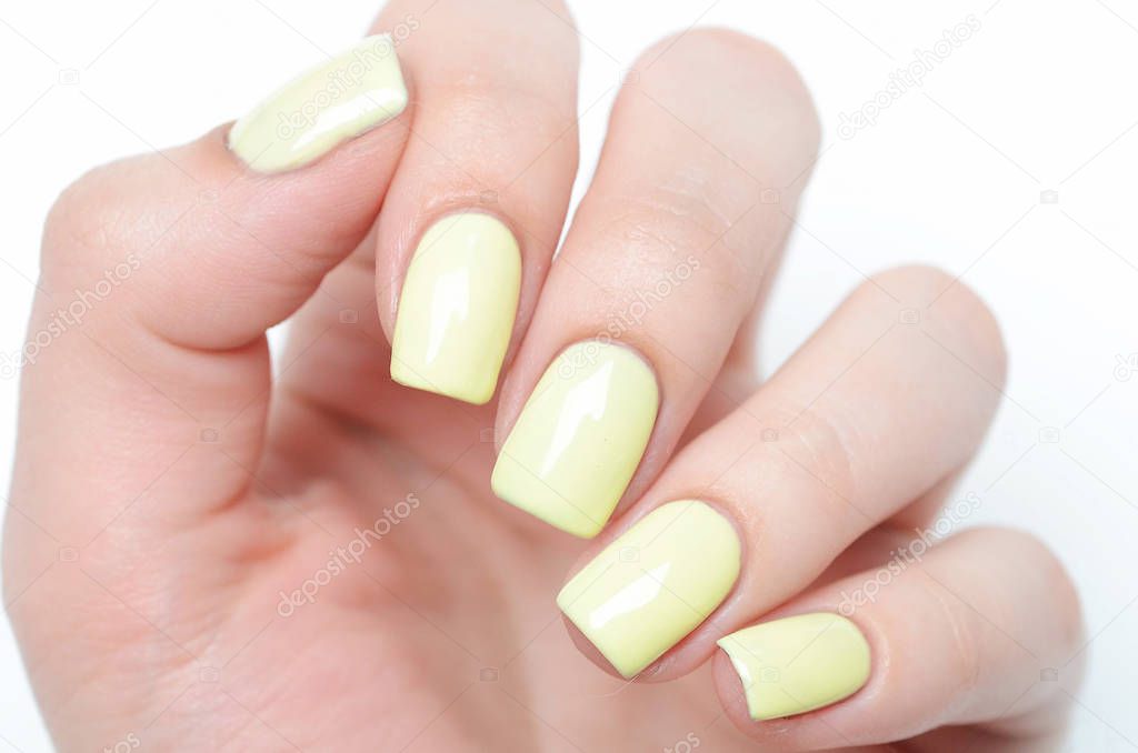Bright yellow manicure with black stripes and sunflowers pattern on white background