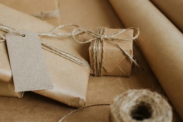 Gift box packaging. Kraft wrapping paper and natural twine. Recycling material. Happy holiday present, surprise. Gifts for boxing day. Delivery service, shipping. Handwork art craft. Celebration event