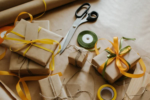 Gift box packaging. Kraft wrapping paper and natural twine. Recycling material. Happy holiday present, surprise. Gifts for boxing day. Delivery service, shipping. Handwork art craft. Celebration event