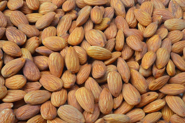 Penutup seluruh kacang almond untuk latar belakang — Stok Foto