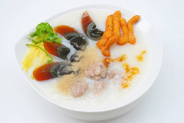 Congee con huevos conservados, sopa de arroz hervido —  Fotos de Stock