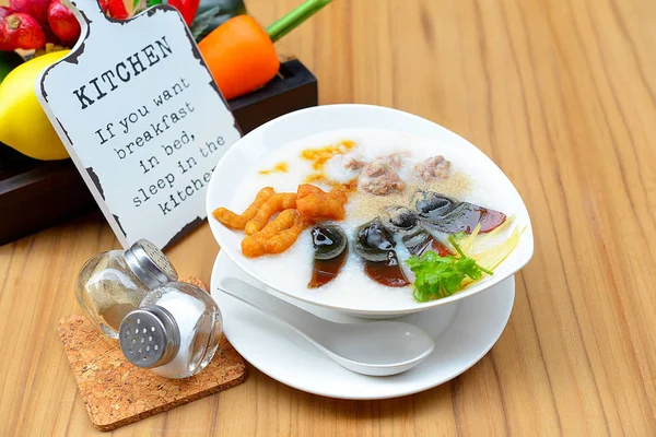 Congee with preserved eggs , boiled rice soup