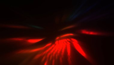 Hareket halindeki ışık parçacıkları, siyah arkaplanda parlayan çok renkli ışınlar yaratıyor. Enerji dolu parıldayan ışıklar duvar kağıdı.