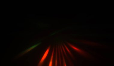 Hareket halindeki ışık parçacıkları, siyah arkaplanda parlayan çok renkli ışınlar yaratıyor. Enerji dolu parıldayan ışıklar duvar kağıdı.